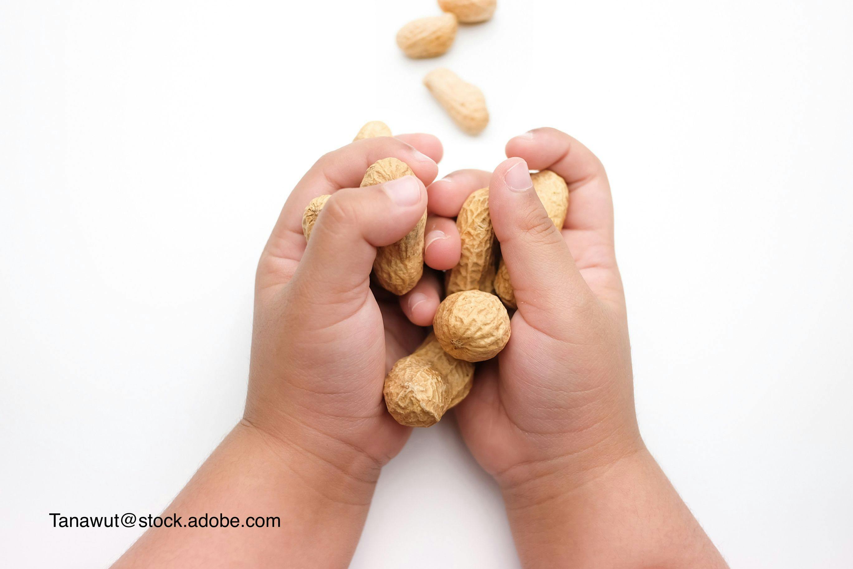 child holding peanuts